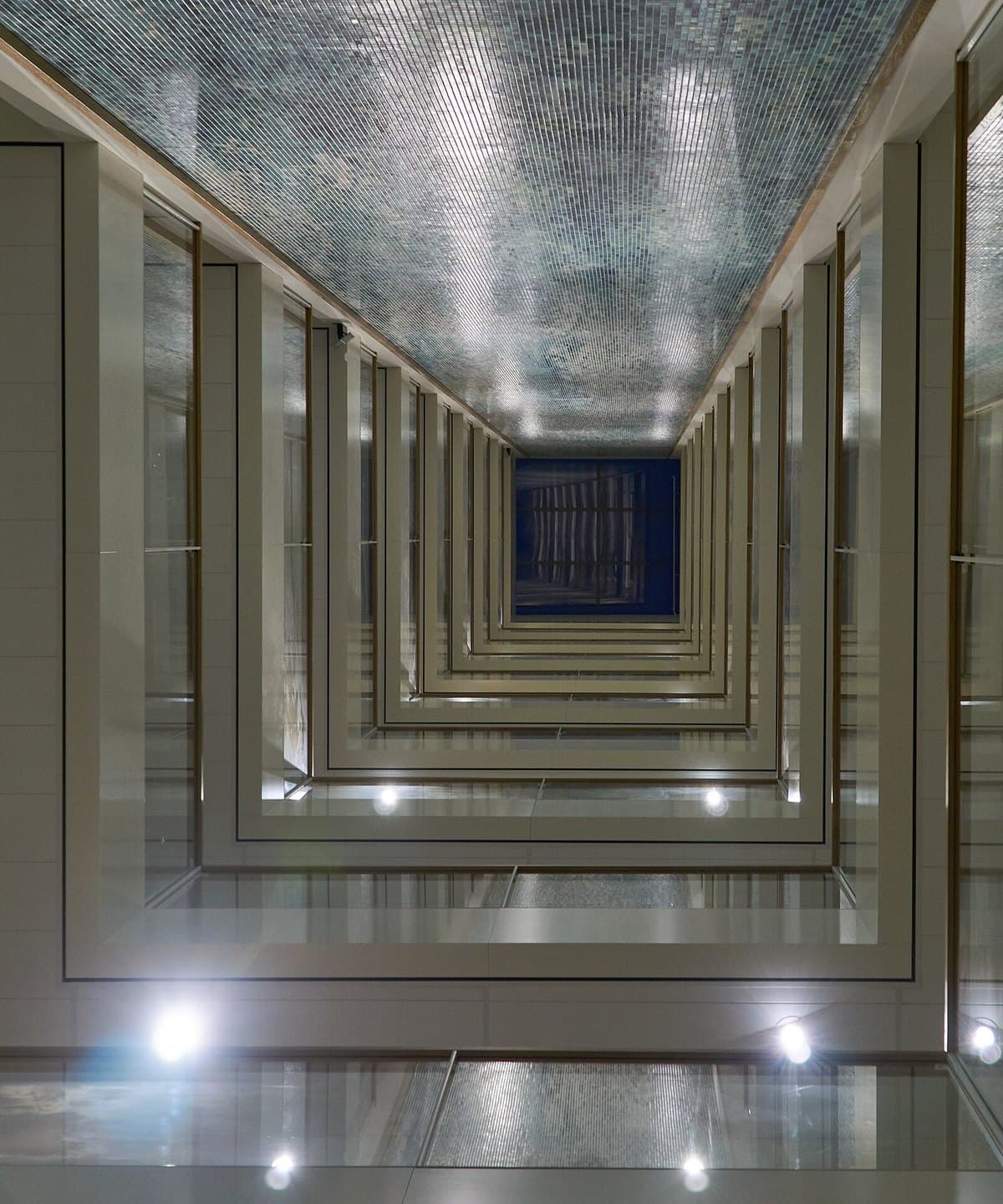 A modern office building atrium, representing a growing mid-size team